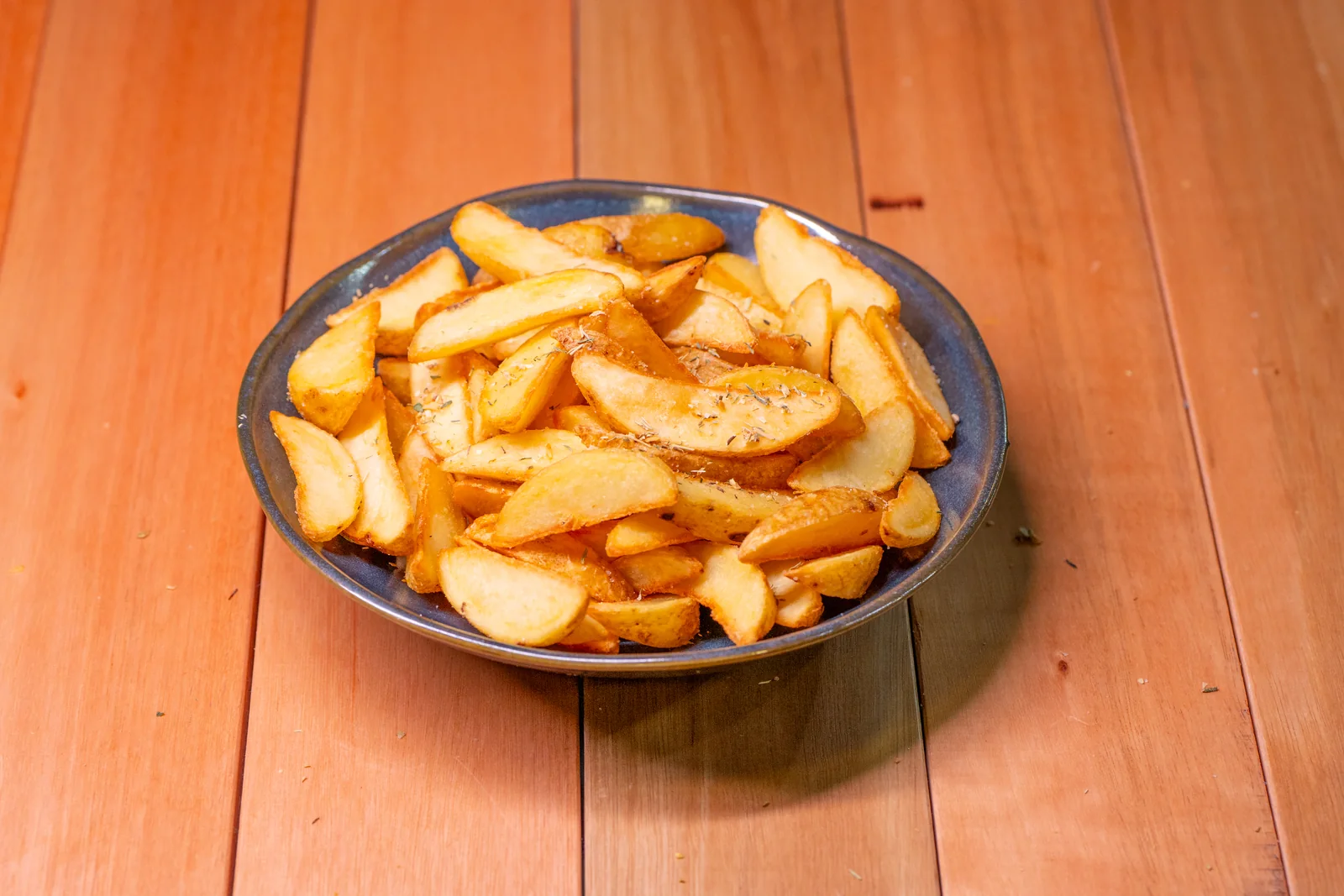 Porção de batatas rústicas da Smash Burger